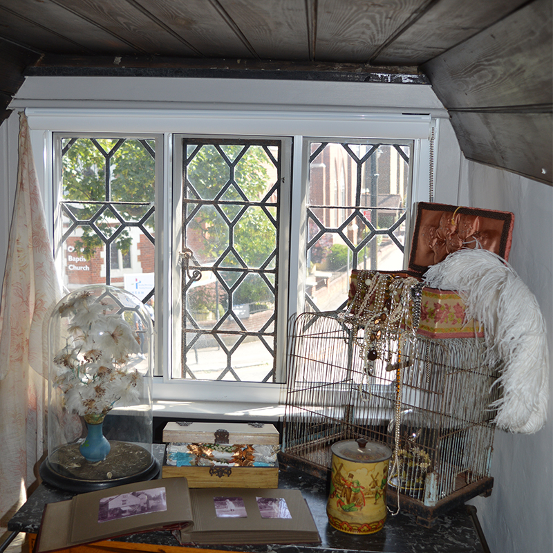 White hall museum bedroom window with single glazed leaded lights and thermal secondary glazing