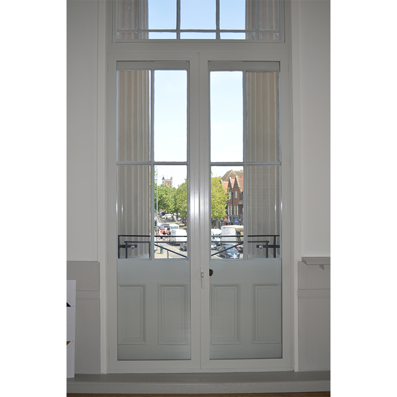 Large casement doors over looking the balcony of the Assembly Room at St Albans Town Museum and Gallery