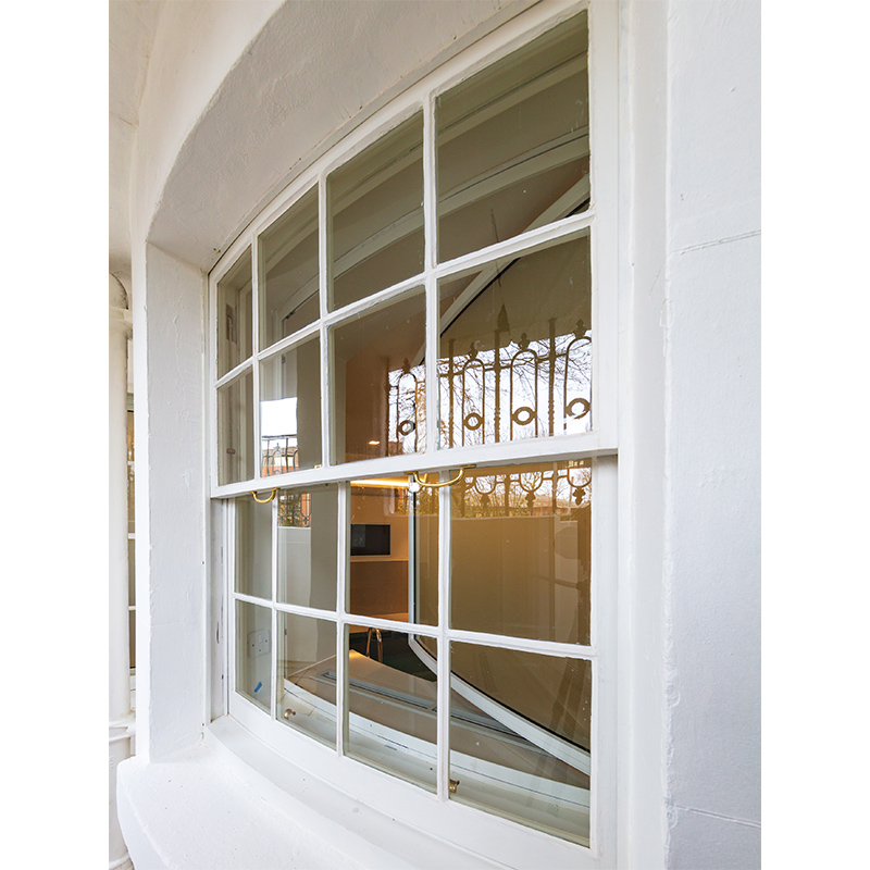 Kidderpore Hall curved box sash window with Selectaglaze secondary glazing curved on plan unit installed on the inside of the swimming pool area