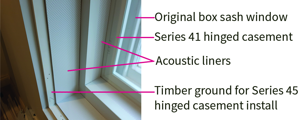 an adapted window reveal to accept two sets of secondary glazing and acoustic liners